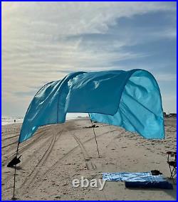 Portable beach sun shade canopy wind supported